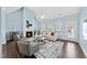 Cozy living room with vaulted ceiling, gas fireplace, and many windows at 308 Minton Valley Ln, Cary, NC 27519