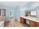 Bright main bathroom with dual sinks, vanity, tiled shower, and tub perfect for relaxation at 308 Minton Valley Ln, Cary, NC 27519