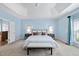 Spacious main bedroom featuring a tray ceiling, cozy carpet, and an ensuite bathroom at 308 Minton Valley Ln, Cary, NC 27519