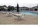 Community pool with tables, chairs, umbrellas and plenty of space for a relaxing day at 308 Minton Valley Ln, Cary, NC 27519