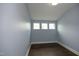 Cozy bedroom with hardwood floors and three sunny windows at 309 Hines Point Dr, Rolesville, NC 27571