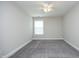 Serene bedroom with carpet flooring, ceiling fan and a sunny window at 309 Hines Point Dr, Rolesville, NC 27571
