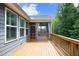 Back deck on a home with gray siding, stairs, a fenced yard, and mature trees at 309 Hines Point Dr, Rolesville, NC 27571