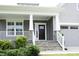 Inviting front porch with stone steps, white railings, and a stylish front door perfect for relaxing at 309 Hines Point Dr, Rolesville, NC 27571