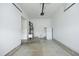 Spacious two car garage with white walls, concrete floors, sink, refrigerator, and water heater at 309 Hines Point Dr, Rolesville, NC 27571