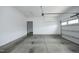 Spacious two car garage with white walls and concrete floors and open door to living area at 309 Hines Point Dr, Rolesville, NC 27571