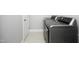 Modern laundry room with stainless steel washer and dryer; bright and well-maintained at 309 Hines Point Dr, Rolesville, NC 27571