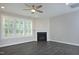 This living room offers a fireplace, hardwood floors, recessed lights, and a ceiling fan at 309 Hines Point Dr, Rolesville, NC 27571