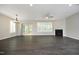 A spacious living room featuring hardwood floors, recessed lighting, a fireplace, and access to a deck at 309 Hines Point Dr, Rolesville, NC 27571