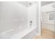 Bathroom features a white tiled shower and neutral flooring at 3129 Elm Tree Ln, Raleigh, NC 27614