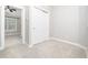 Cozy bedroom featuring carpet, closet, and natural light at 3129 Elm Tree Ln, Raleigh, NC 27614