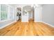 The dining area has hardwood floors and an open view of the kitchen with stainless steel appliances at 3129 Elm Tree Ln, Raleigh, NC 27614
