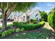 Beautiful home exterior with lush landscaping, a brick-accented facade, and a well-maintained lawn at 3129 Elm Tree Ln, Raleigh, NC 27614