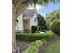 A charming view of the exterior showcasing manicured landscaping, brick accents, and a well-maintained lawn at 3129 Elm Tree Ln, Raleigh, NC 27614