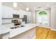 Modern kitchen featuring granite counters, stainless steel appliances, and an island with sink at 3129 Elm Tree Ln, Raleigh, NC 27614
