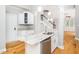 Modern kitchen with granite counters, stainless steel appliances, and eat-in island at 3129 Elm Tree Ln, Raleigh, NC 27614