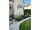 Well-manicured landscaping with a brick exterior, decorative window, and a vibrant mix of plants at 3129 Elm Tree Ln, Raleigh, NC 27614