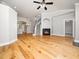 Bright open living room with hardwood floors and a cozy fireplace feature at 3129 Elm Tree Ln, Raleigh, NC 27614