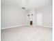 Spacious bedroom with a neutral color palette and view of bathroom at 3129 Elm Tree Ln, Raleigh, NC 27614