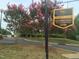 Sports club sign at McConnell Golf Property with blooming crepe myrtle trees at 3129 Elm Tree Ln, Raleigh, NC 27614