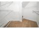 Spacious walk-in closet with wire shelving and carpeted floor at 3129 Elm Tree Ln, Raleigh, NC 27614