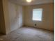 Bedroom with a standard window, a closet, and carpet flooring at 3354 Altamahaw Church Rd, Elon, NC 27244