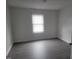 This bedroom has a window letting in lots of natural light and hard surface floors at 3354 Altamahaw Church Rd, Elon, NC 27244