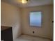 A bedroom with neutral walls and a window, offering a simple and functional space at 3354 Altamahaw Church Rd, Elon, NC 27244