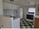 The kitchen features checkered floors, a white refrigerator, and a stainless steel sink at 3354 Altamahaw Church Rd, Elon, NC 27244