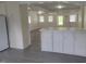 Bright living space with an open layout and view to outside, featuring modern gray vinyl flooring at 3354 Altamahaw Church Rd, Elon, NC 27244