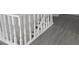 The staircase has white railings and hard surface floors at 3354 Altamahaw Church Rd, Elon, NC 27244