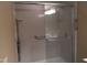 Accessible bathroom with a sliding glass shower door and support bars at 3405 Ode Turner Rd, Hillsborough, NC 27278