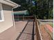 View from the deck showing the parking area with carport, and red brick path to the front of the home at 3405 Ode Turner Rd, Hillsborough, NC 27278