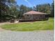 Inviting exterior view with expansive yard, covered parking, and classic ranch-style home at 3405 Ode Turner Rd, Hillsborough, NC 27278