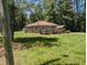 A beautiful property nestled among mature trees, featuring a quaint ranch home with a large yard at 3405 Ode Turner Rd, Hillsborough, NC 27278