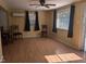 Spacious living room with wood-look floors, a ceiling fan, and two windows at 3405 Ode Turner Rd, Hillsborough, NC 27278