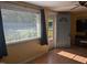 Bright living room with a window, blinds, and a view of the front porch at 3405 Ode Turner Rd, Hillsborough, NC 27278