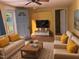 Cozy living room with two sofas, ceiling fan, and a light blue entry door at 3405 Ode Turner Rd, Hillsborough, NC 27278