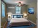 Charming bedroom with a queen bed, windows, and a ceiling fan at 3405 Ode Turner Rd, Hillsborough, NC 27278