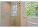 Bathroom with glass shower and window views at 3509 Carlton Square Pl, Raleigh, NC 27612
