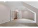 Expansive bonus room with neutral walls, carpeted floors, and elegant french doors at 3509 Carlton Square Pl, Raleigh, NC 27612