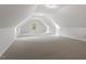Bright bonus room with neutral walls, carpet floors, and natural light from surrounding window at 3509 Carlton Square Pl, Raleigh, NC 27612