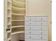 Closet features built-in shelving and dresser for optimal storage at 3509 Carlton Square Pl, Raleigh, NC 27612