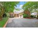 Charming brick home with manicured landscaping and a circular driveway at 3509 Carlton Square Pl, Raleigh, NC 27612