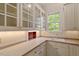 Bright kitchen with white cabinets and light countertops at 3509 Carlton Square Pl, Raleigh, NC 27612