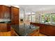 Well-appointed kitchen with granite island, stainless appliances, and open view to the living room at 3509 Carlton Square Pl, Raleigh, NC 27612