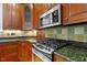 Close up view of kitchen with stainless steel appliances and granite countertops at 3509 Carlton Square Pl, Raleigh, NC 27612