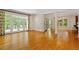 Spacious living room boasts hardwood floors, large windows, and elegant architectural details at 3509 Carlton Square Pl, Raleigh, NC 27612