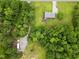 Aerial view of a home nestled amongst the trees at 3906 Union Ridge Rd, Burlington, NC 27217