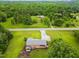 Aerial view of a home with large yard surrounded by mature trees at 3906 Union Ridge Rd, Burlington, NC 27217